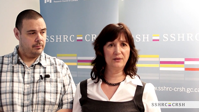 Video still of Chris Andersen and Yvonne Poitras-Pratt explaining their research on the subject of Crowdsourcing Métis Research