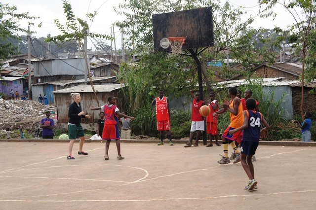 Kacey playing basketball with students from the Mathare Slum in Nairobi, Kenya